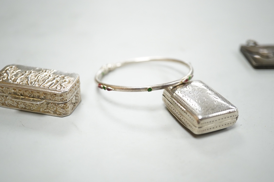 A small group of silver items including a William IV vinaigrette, William Simpson, Birmingham, 1835, 30mm, a later stamp case, two mounted photograph frames, two hinged bangles, together with a group of sterling or white